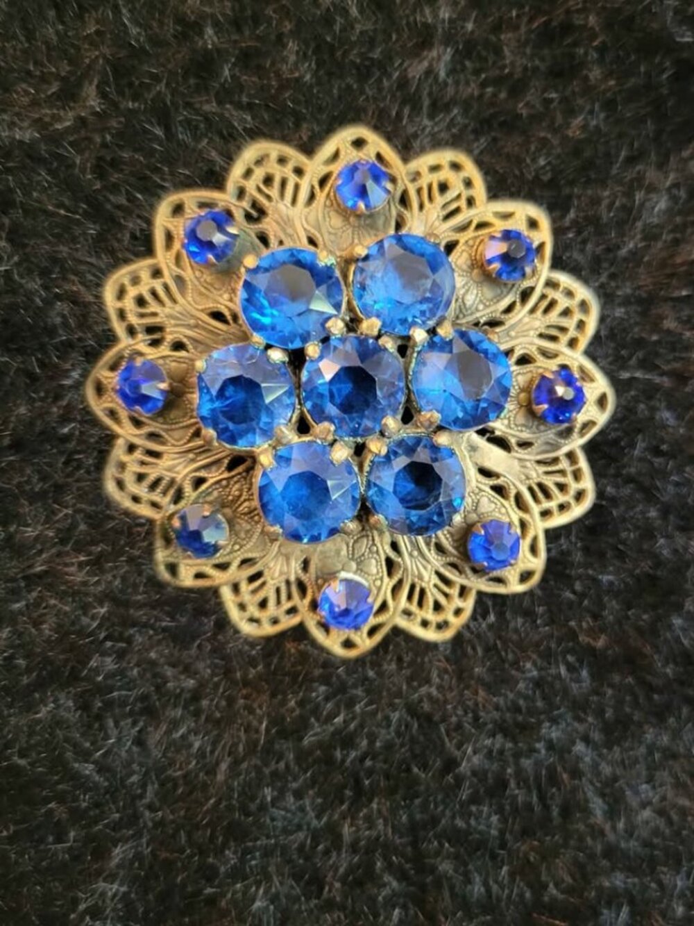 Vintage Gold-Tone Brooch With Blue Rhinestones And Filigree Design